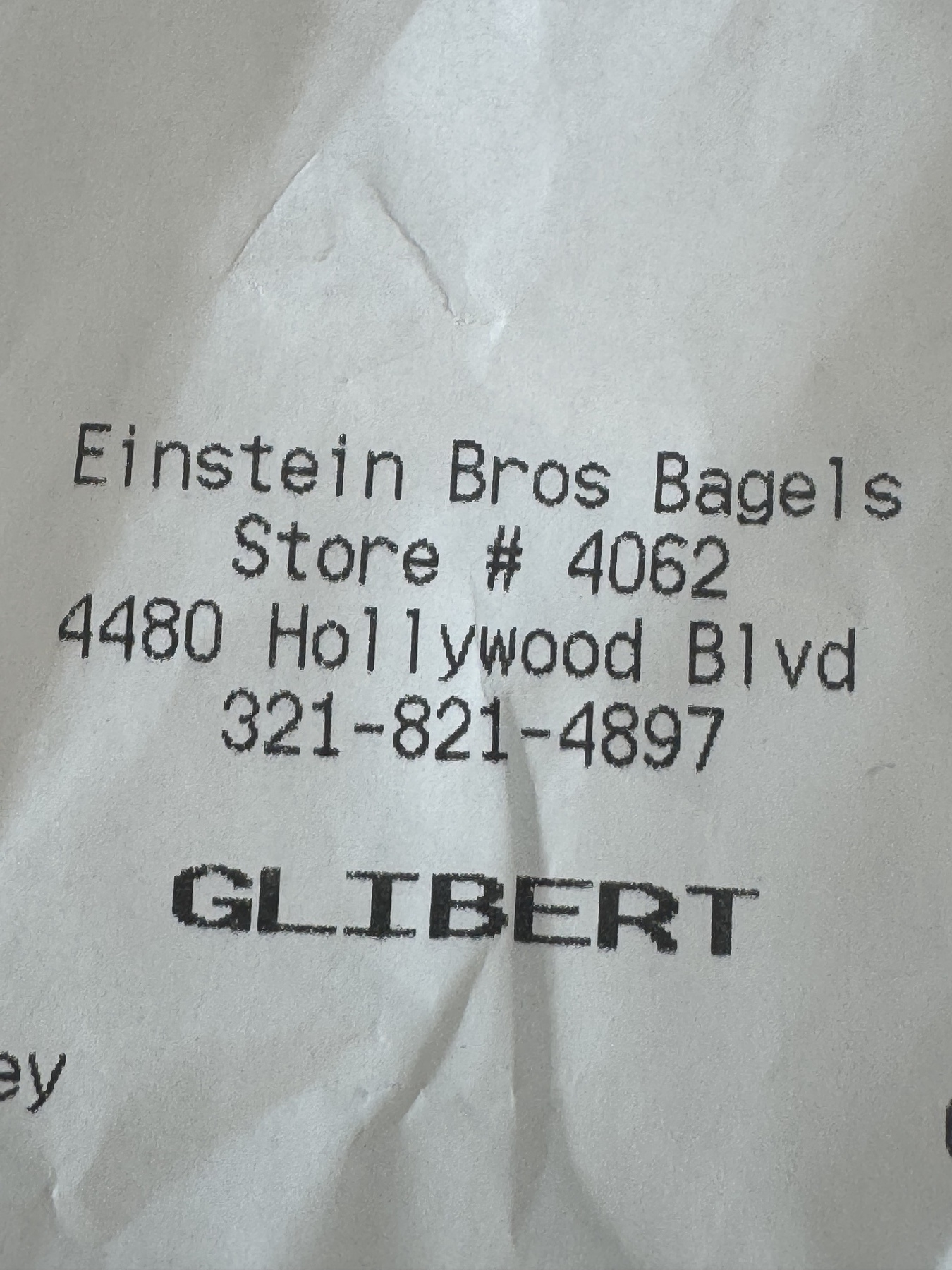 A receipt displays information for Einstein Bros Bagels order with my name misspelled as GLIBERT